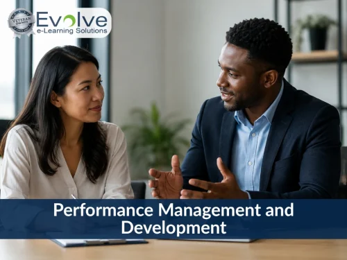 Two colleagues discussing workplace topics, with text overlay reading Performance Management and Development by Evolve e-Learning Solutions